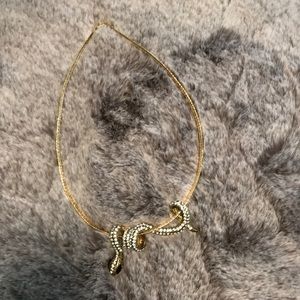 Gold and diamonds snake necklace